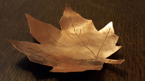 Hand cut and shaped copper leaf